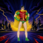 Preview: DC Multiverse Robin Actionfigur (Dick Grayson) im Silver-Age-Look, rotes Oberteil mit gelbem Umhang und grüner Schuppenhose, vor Comic-Skyline-Hintergrund mit Blitzen